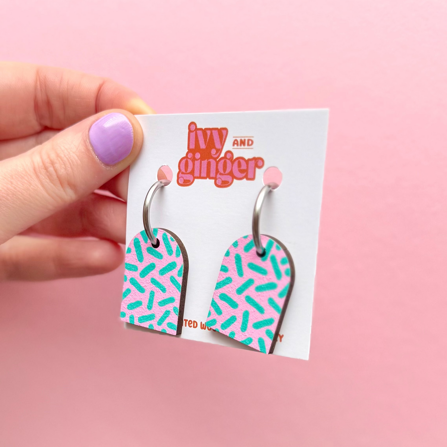Pink and teal dash print arch dangle hoop earrings
