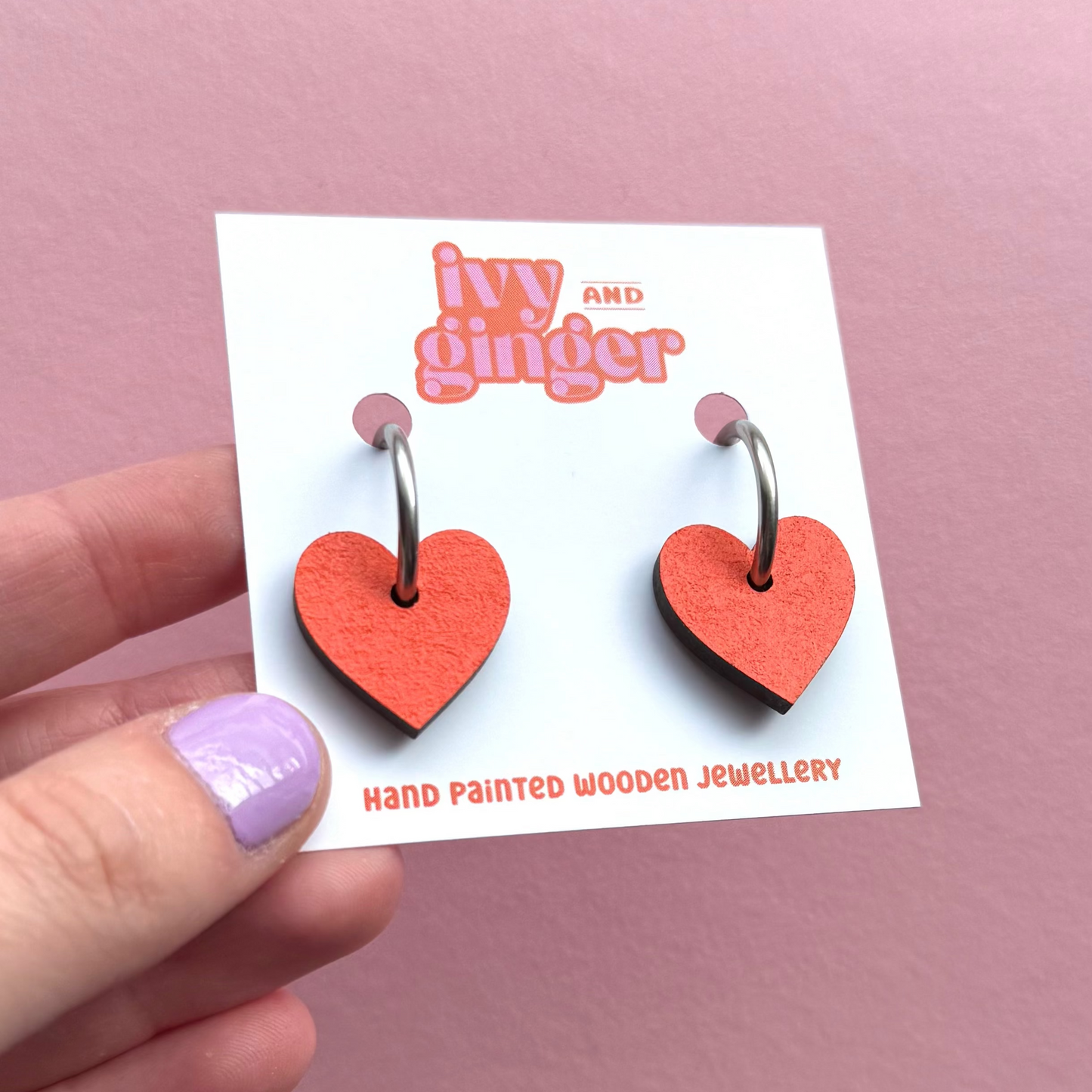 Orange heart shaped hoop earrings