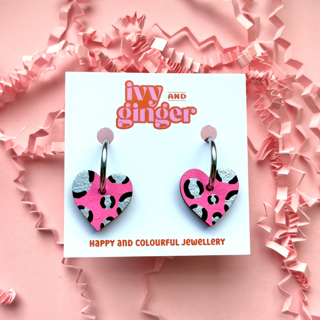 Bright pink and silver leopard print heart shaped hoop earrings