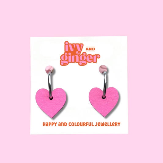 Bright pink heart shaped hoop earrings