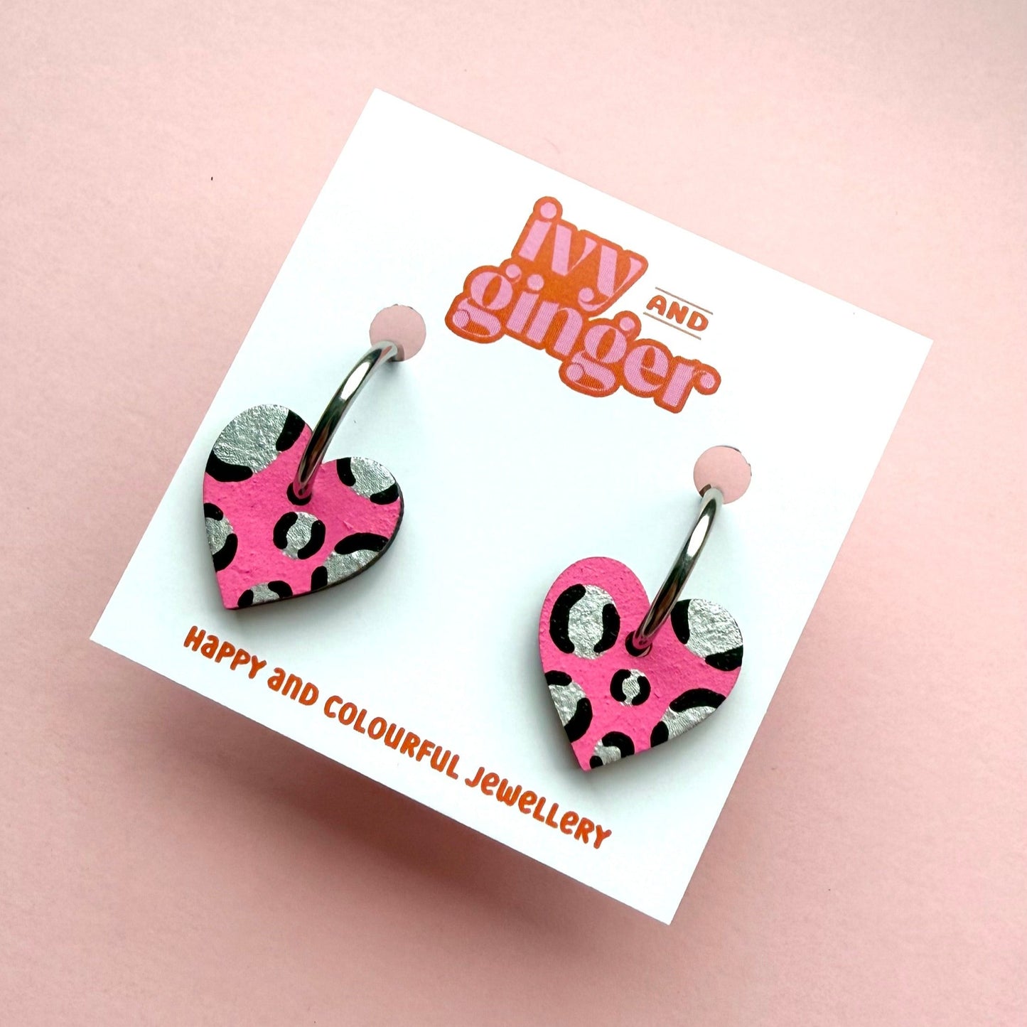 Bright pink and silver leopard print heart shaped hoop earrings