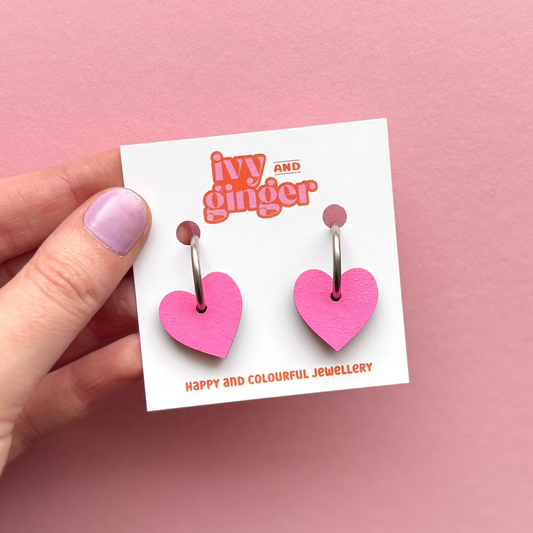 Bright pink heart shaped hoop earrings