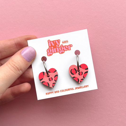Deep pink and red leopard print small heart hoop earrings