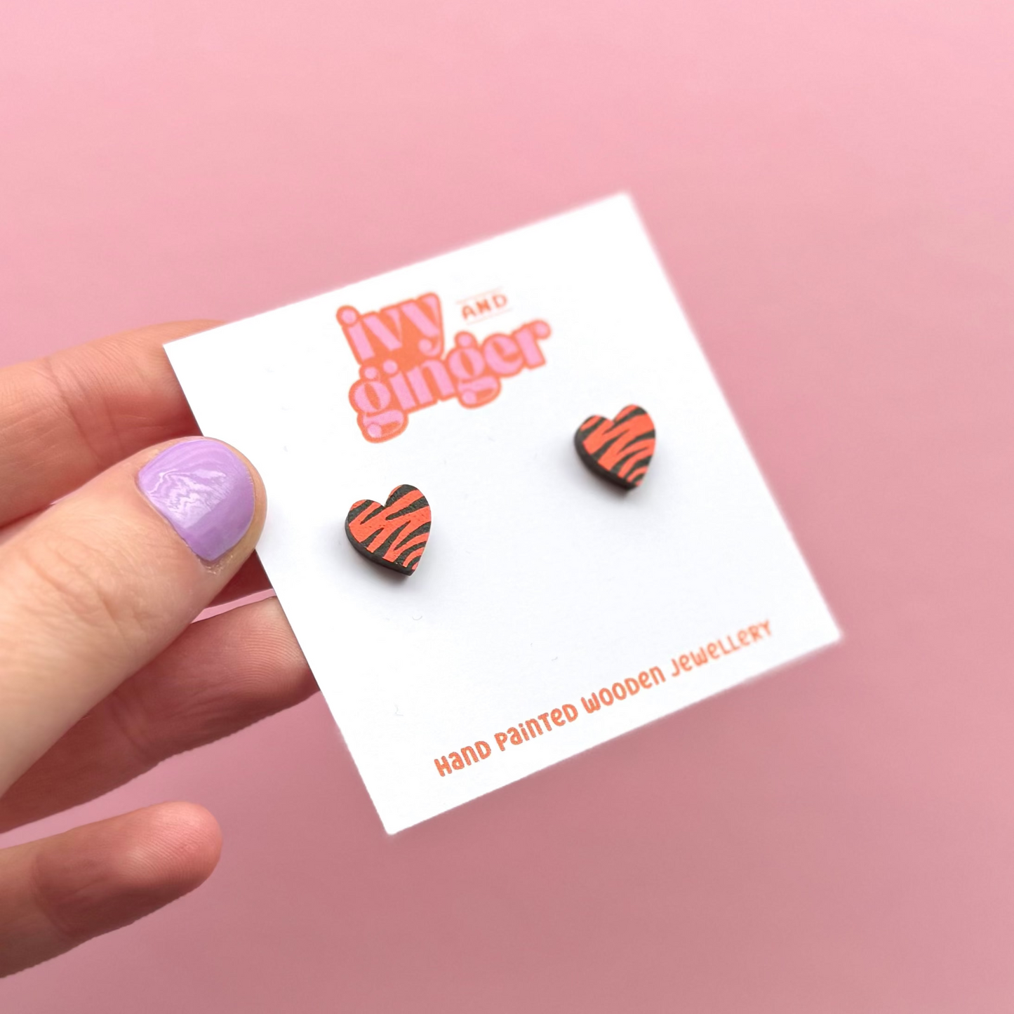 Mini orange and black zebra print heart stud earrings
