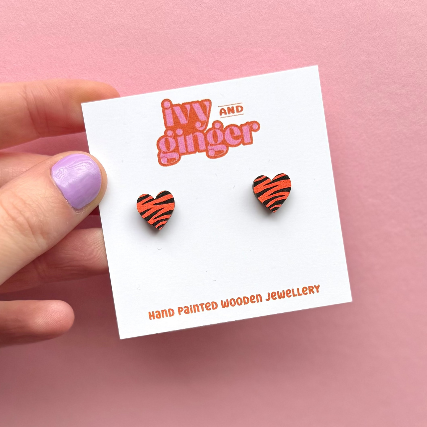 Mini orange and black zebra print heart stud earrings