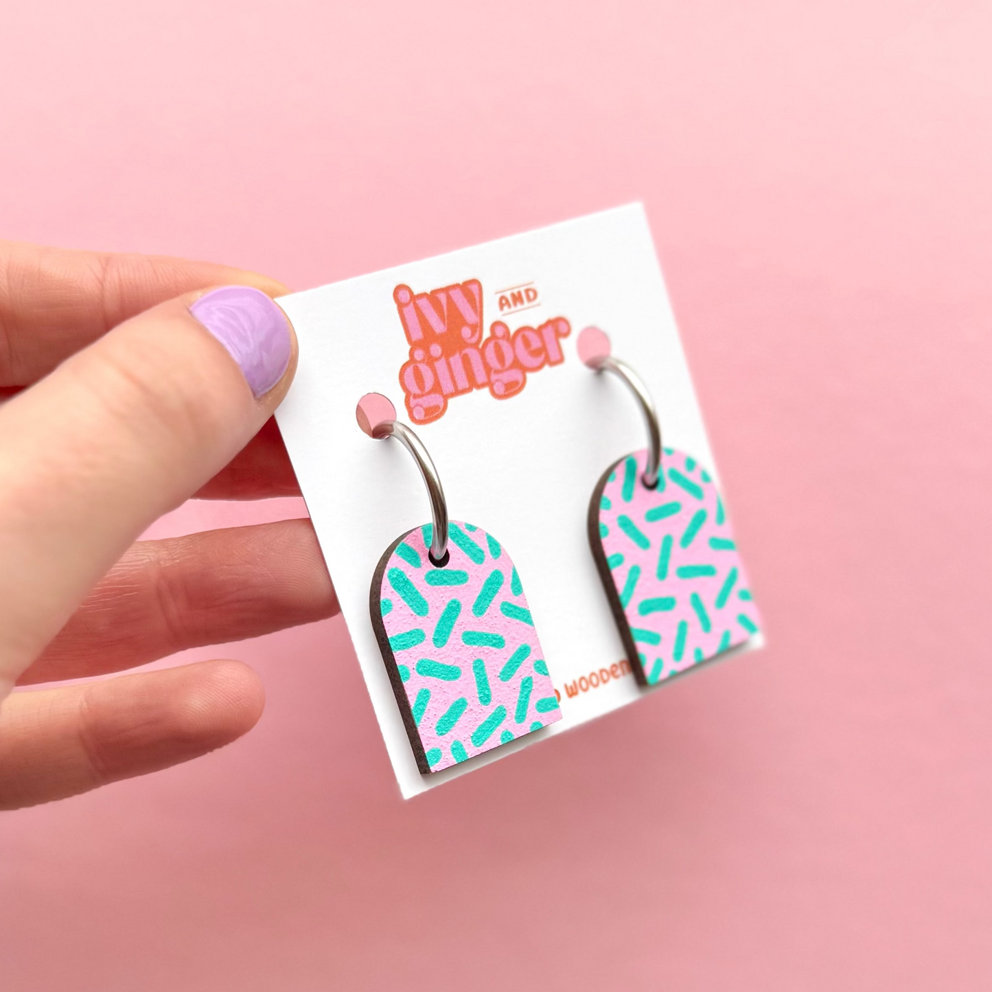 Pink and teal dash print arch dangle hoop earrings
