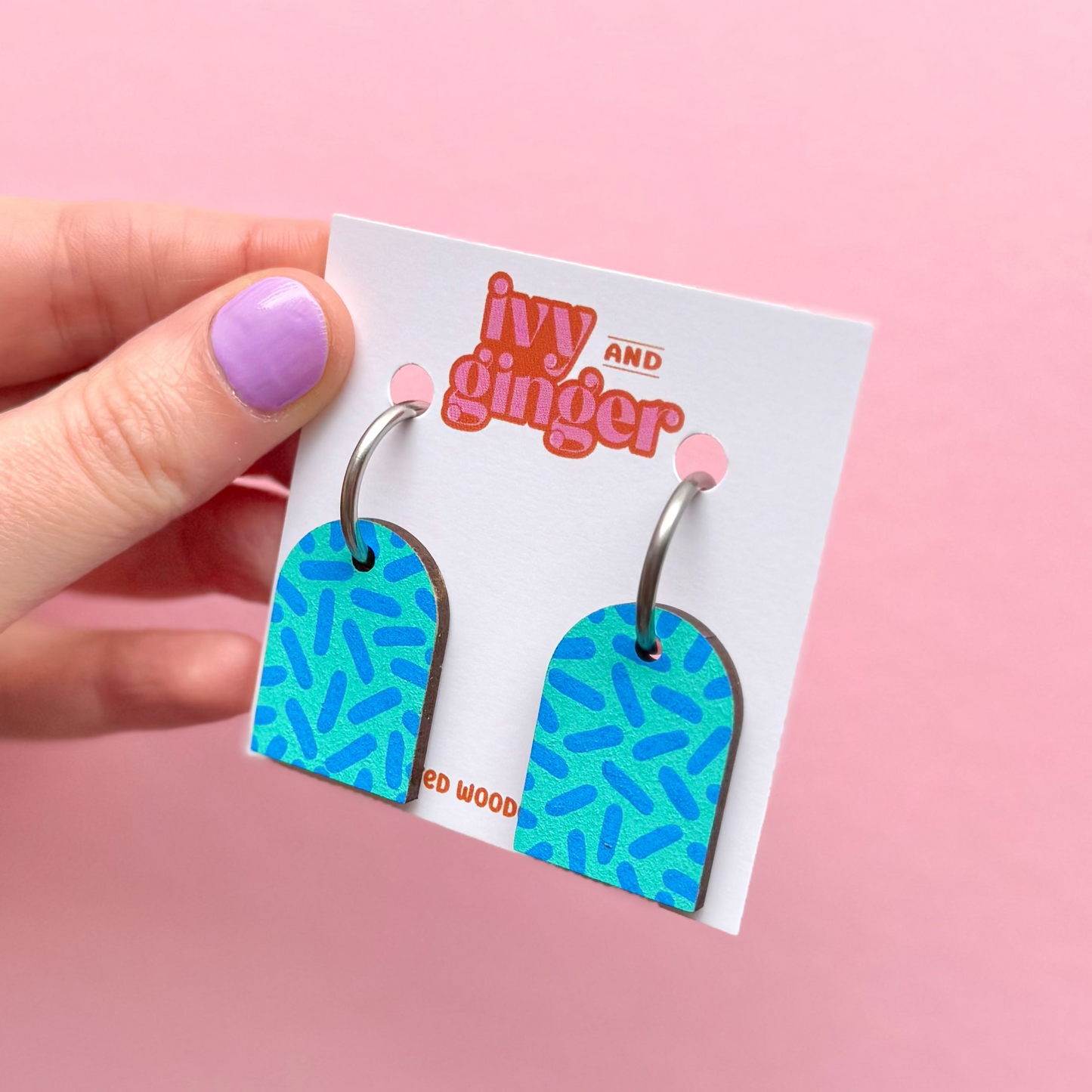 Teal and sky blue dash print arch dangle hoop earrings