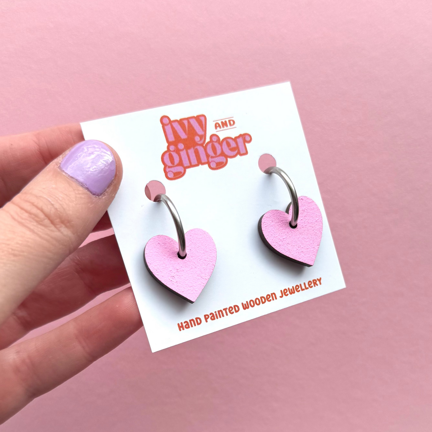 Light pink heart shaped hoop earrings