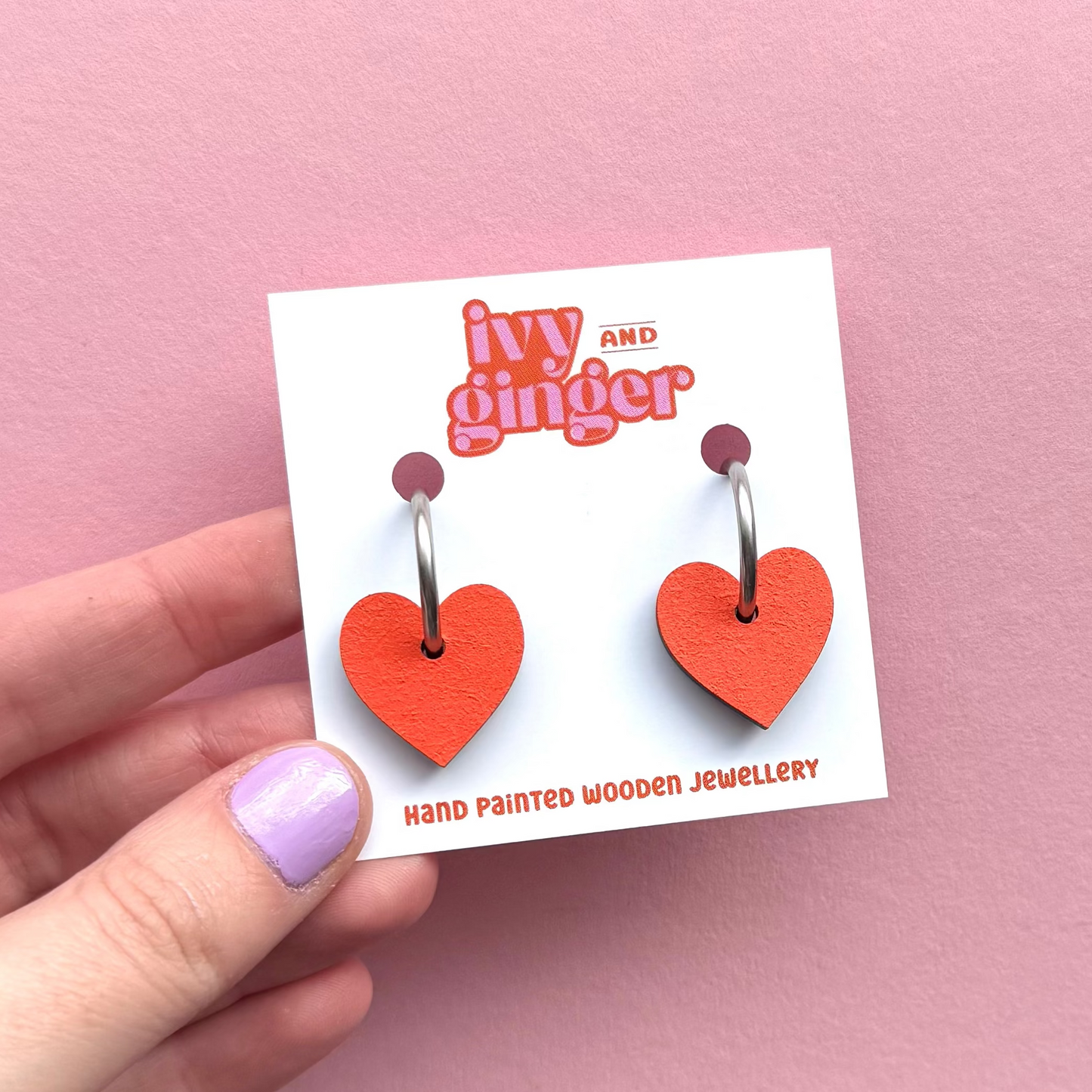 Orange heart shaped hoop earrings