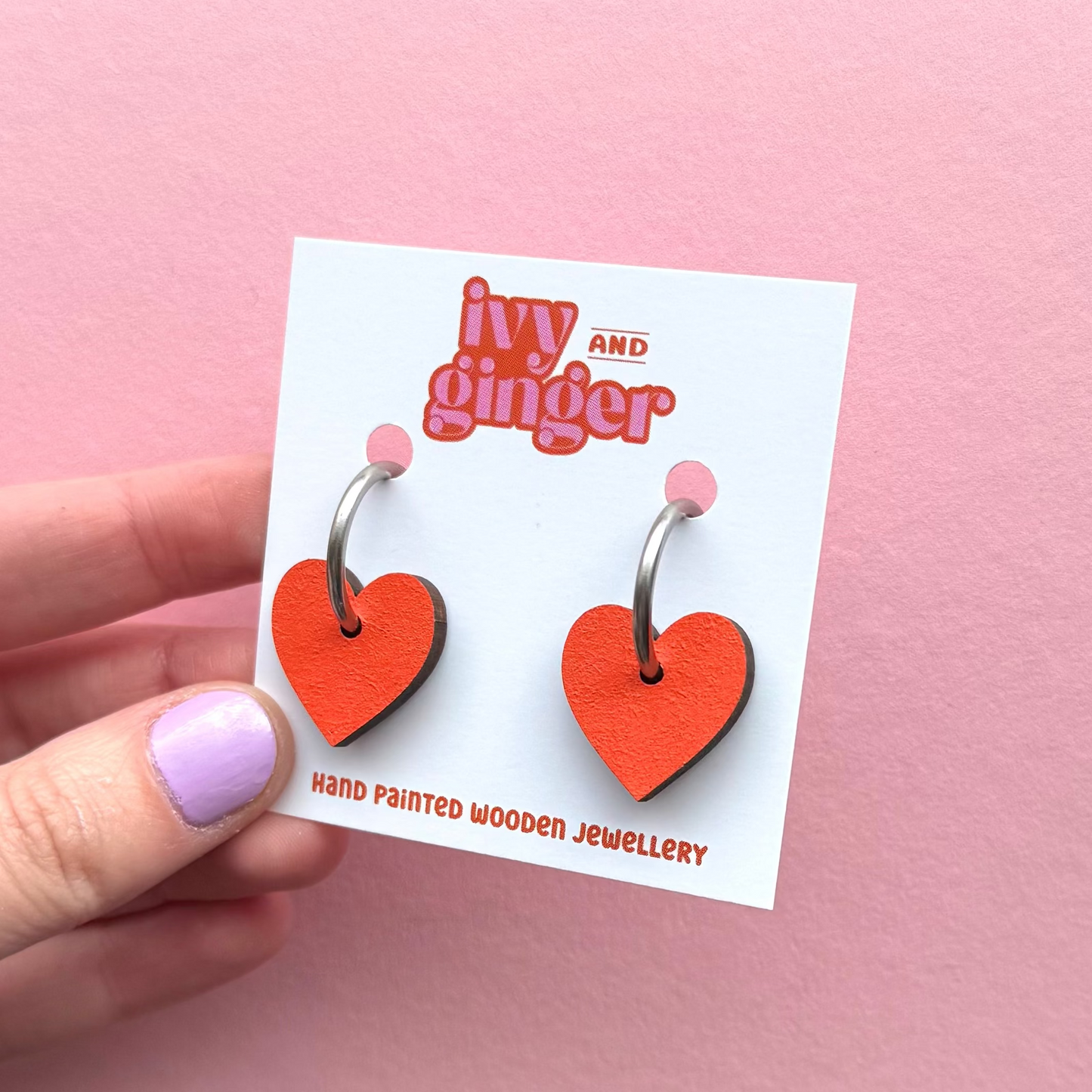 Orange heart shaped hoop earrings