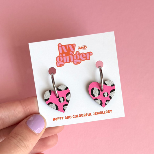 Bright pink and silver leopard print heart shaped hoop earrings