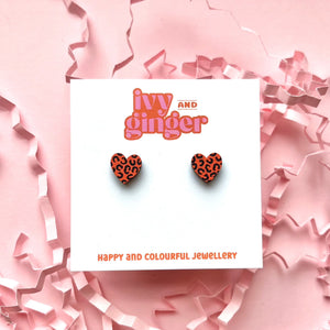 Mini orange and black leopard print heart studs