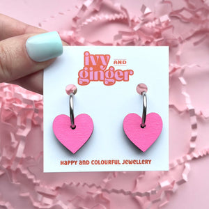 Bright pink heart shaped hoop earrings