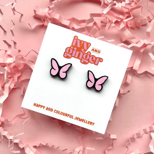 Light pink and black butterfly stud earrings