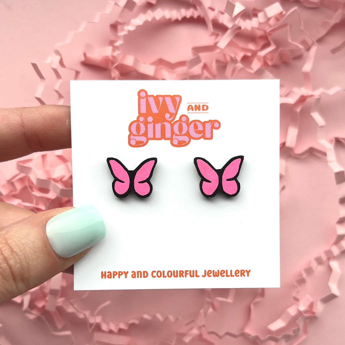 Bright pink and black butterfly stud earrings